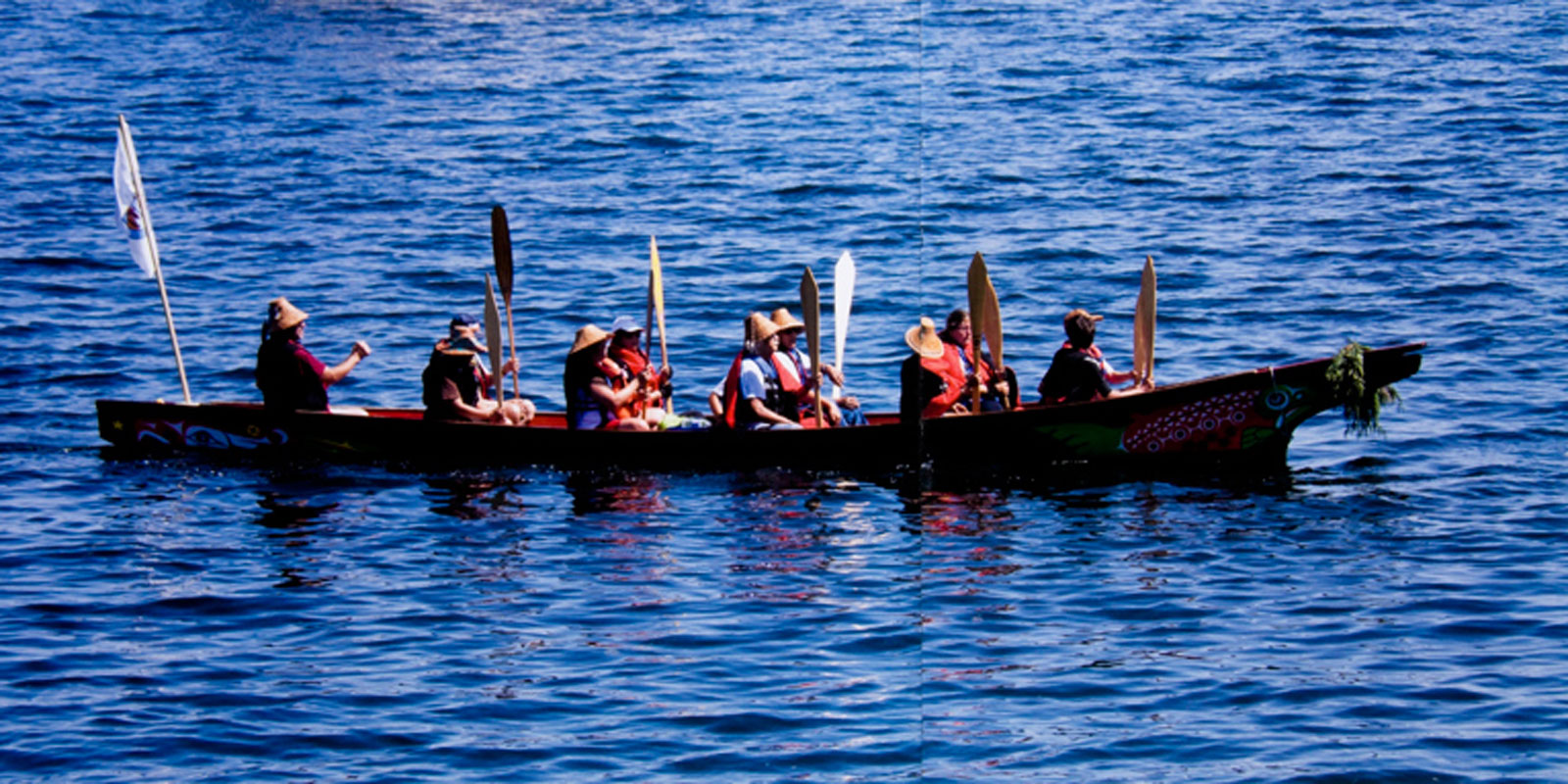 A group of people in a canoe on the water